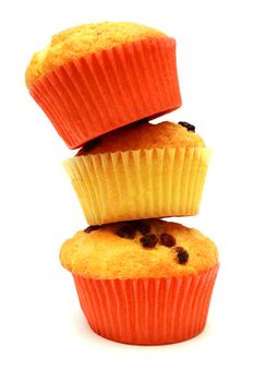 Tasty yellow three muffins on standig each other