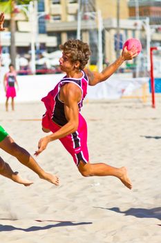 CADIZ, SPAIN - JULY 19: Unidentified players compete in a match between Autoescuela Barquin and CadizSur Seguros BMPY in the 19th league of beach handball of Cadiz on July 19, 2011 in Cadiz, Spain