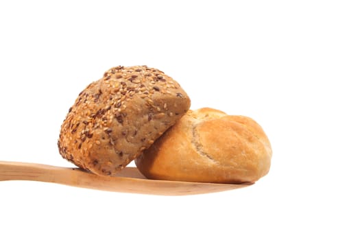 Two buns on a wooden spoon against a white background