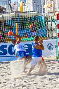 CADIZ, SPAIN - JULY 19: Unidentified players compete in a match between Valcarcel Recuperado and DecoHogar in the 19th league of beach handball of Cadiz on July 19, 2011 in Cadiz, Spain