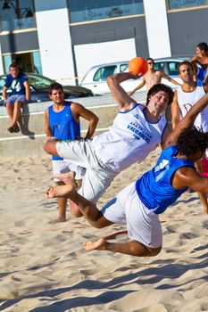 CADIZ, SPAIN - JULY 19: Unidentified players compete in a match between Valcarcel Recuperado and DecoHogar in the 19th league of beach handball of Cadiz on July 19, 2011 in Cadiz, Spain