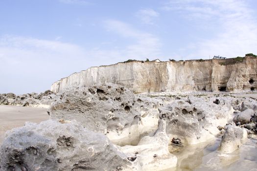 Chalk cliff along the beach in Normandie in France