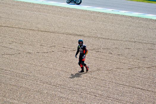 JEREZ DE LA FRONTERA, SPAIN-MAR 5: 125cc motorcyclist Daniel Kartheininge after an accident on the official training of the world championship of MotoGP on March 5, 2011 in Jerez de la Frontera, Spain