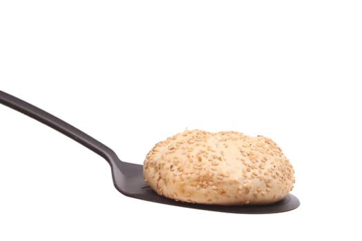 Bun on a spoon against a white background