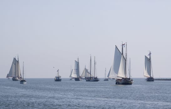 Old sail ships leaving the former harbour-town Enkhuizen