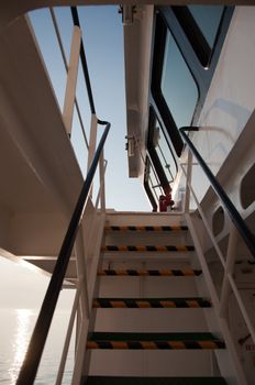 View on an industrial boat bridge from the deck below in evening sundown