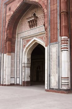 Ornate entrance to the ancient mosque (Qal'a-i-Kuhna) inside the historic fort of Purana Qila in Delhi, India. 16th Century AD.