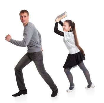 Girl with a book in her hands ran over boyfriend. Isolated on white background