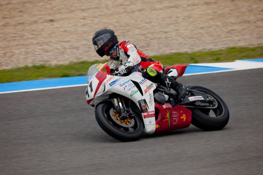 JEREZ DE LA FRONTERA, SPAIN - NOV 20: Stock Extreme motorcyclist Didac Fernandez takes a curve in the CEV championship on Nov 20, 2010, in Jerez de la Frontera, Spain