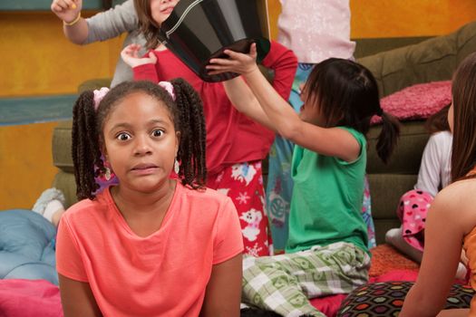 Shocked little African-American kid at a sleepover