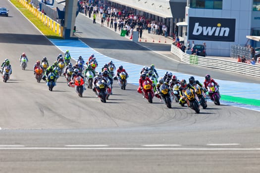 JEREZ DE LA FRONTERA, SPAIN - APR 17: Motorbike competitors begin the Moto2 race in the CEV Championship on April 17, 2011 in Jerez de la Frontera, Spain.