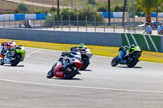 JEREZ DE LA FRONTERA, SPAIN - APR 17: Motorbike competitors begin the Moto2 race in the CEV Championship on April 17, 2011 in Jerez de la Frontera, Spain.