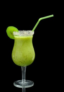 A Kiwi Smoothie in Cocktail Glass decorated with a Slice of Kiwi and a Straw on Black background