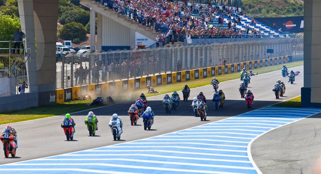 JEREZ DE LA FRONTERA, SPAIN - APR 17: Motorbike competitors begin the uneven 125cc race in the CEV Championship on April 17, 2011 in Jerez de la Frontera, Spain.