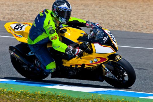 JEREZ DE LA FRONTERA, SPAIN - APR 17: Stock Extreme motorcyclist Juan Eric Gomez takes a curve in the CEV Championship race on April 17, 2011 in Jerez de la Frontera, Spain