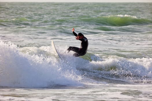 SAN FERNANDO, CADIZ, SPAIN - FEB 19: Unknown surfer taking waves on the 2nd championship of Surf and BodyBoard Impoxibol on Feb 19,2011 on the beach of Camposoto of San Fernando, Cadiz, Spain