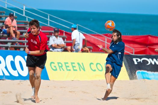 CADIZ, SPAIN -  JUL 30:  Unknown players of the team of Cadiz and Gijon playing the Spanish Championship of Beach Soccer on Jul 30, 2005 on the beach of La Victoria in Cadiz, Spain
