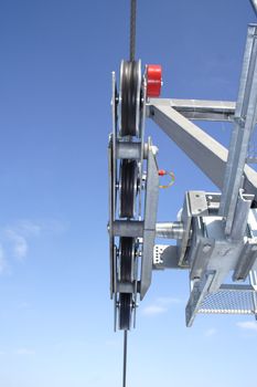 chairlift detail, photo on background of blue sky