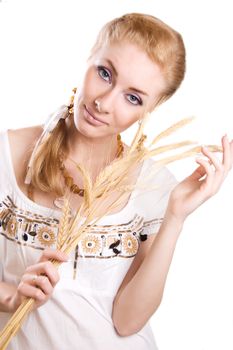 Redheaded woman with sheaf of wheat isolated on white