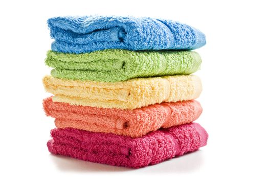 Colorful towels on a white background with space for text