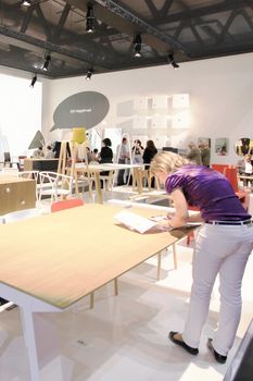 Looking at interior design and architecture solutions during Salone del Mobile 2011, international furnishing accessories tradeshow.