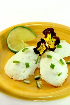 Lemon mousse with fresh lime and flowers