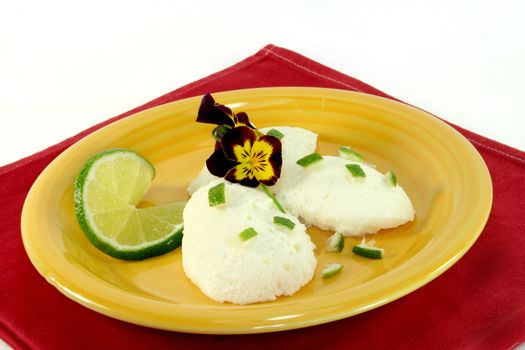 Lemon mousse with fresh lime and flowers