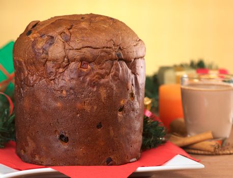 Panettone is a traditional Christmas cake, which is originally from Italy, but is enjoyed now also in many South American countries (Selective Focus, Focus on the front of the cake) 