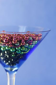 A martini glass full of titanium navel rings