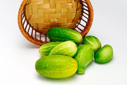 cucumbers and wooden  basket isolated