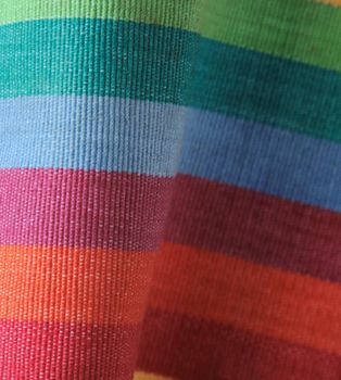 curving fabric in bright, cheerful rainbow shades