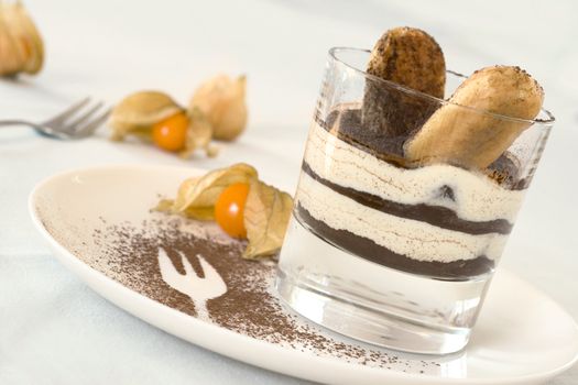 tiramisu served in a glass, slanted shot, shallow DOF