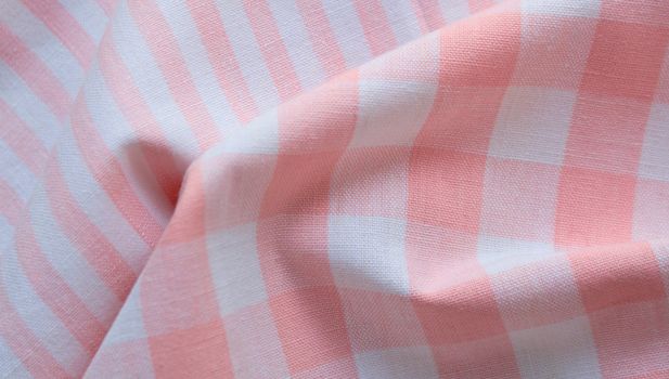 orange and white fabric in stripes and checks
