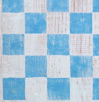blue stenciled checkerboard useful for a background