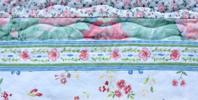 various floral-patterned fabrics with a quilted portion at the top
