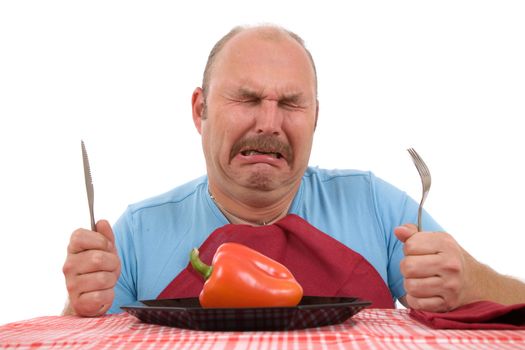 Overweight man looking very unhappy with his diet and bursting into tears