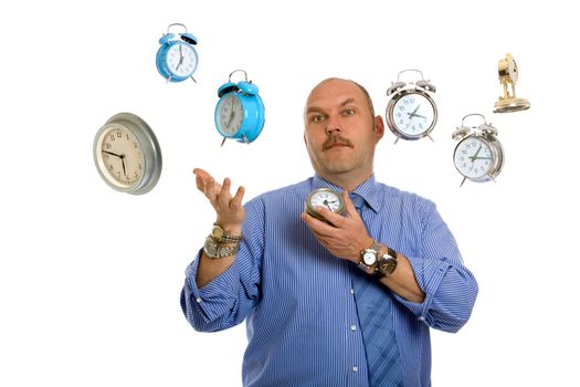 Businessman surrounded by clocks juggling time