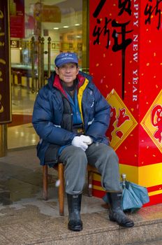 Chinese guard near shanghai shop