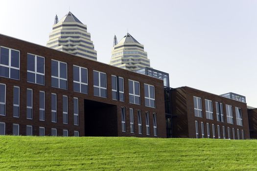 Modern buildings on a green grass