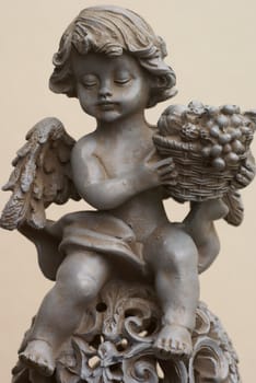 Isolated angel with fruit basket.