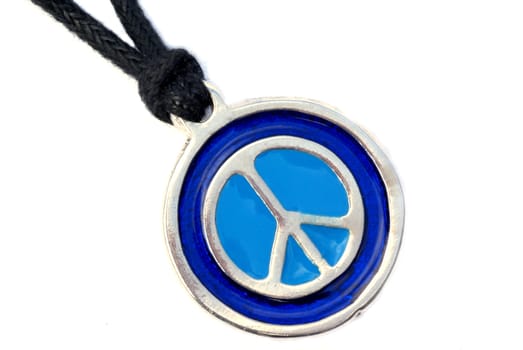 Close up of a peace sign necklace