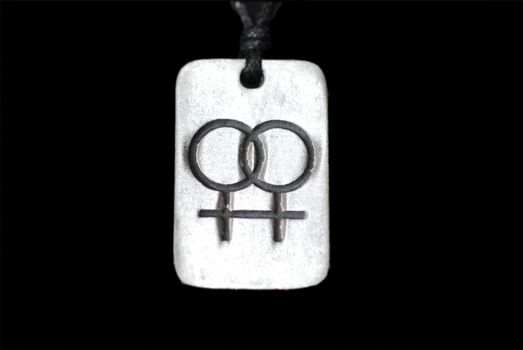 A pendant with a double-venus lesbian symbol.