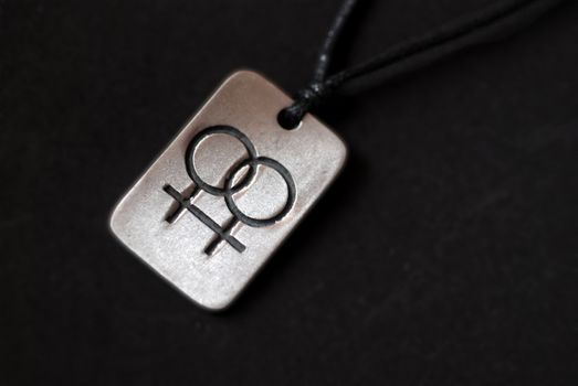 A double venus symbol on a necklace