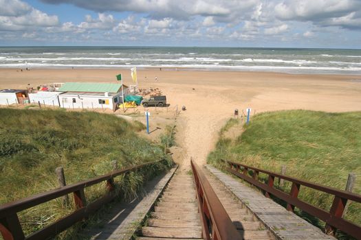 Stairs to the beach and cafe on the Dutch coast