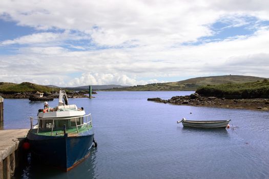 fishing boats in a bay in co cork in ireland