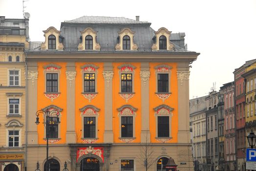 One of old buildings next to Krakow old town market.