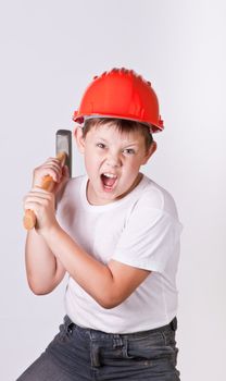 Portrait of a boy in a red protective helmet