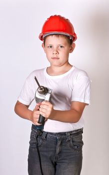 Portrait of a boy in a red protective helmet