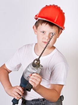 Portrait of a boy in a red protective helmet