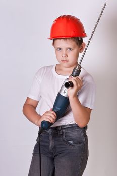 Portrait of a boy in a red protective helmet